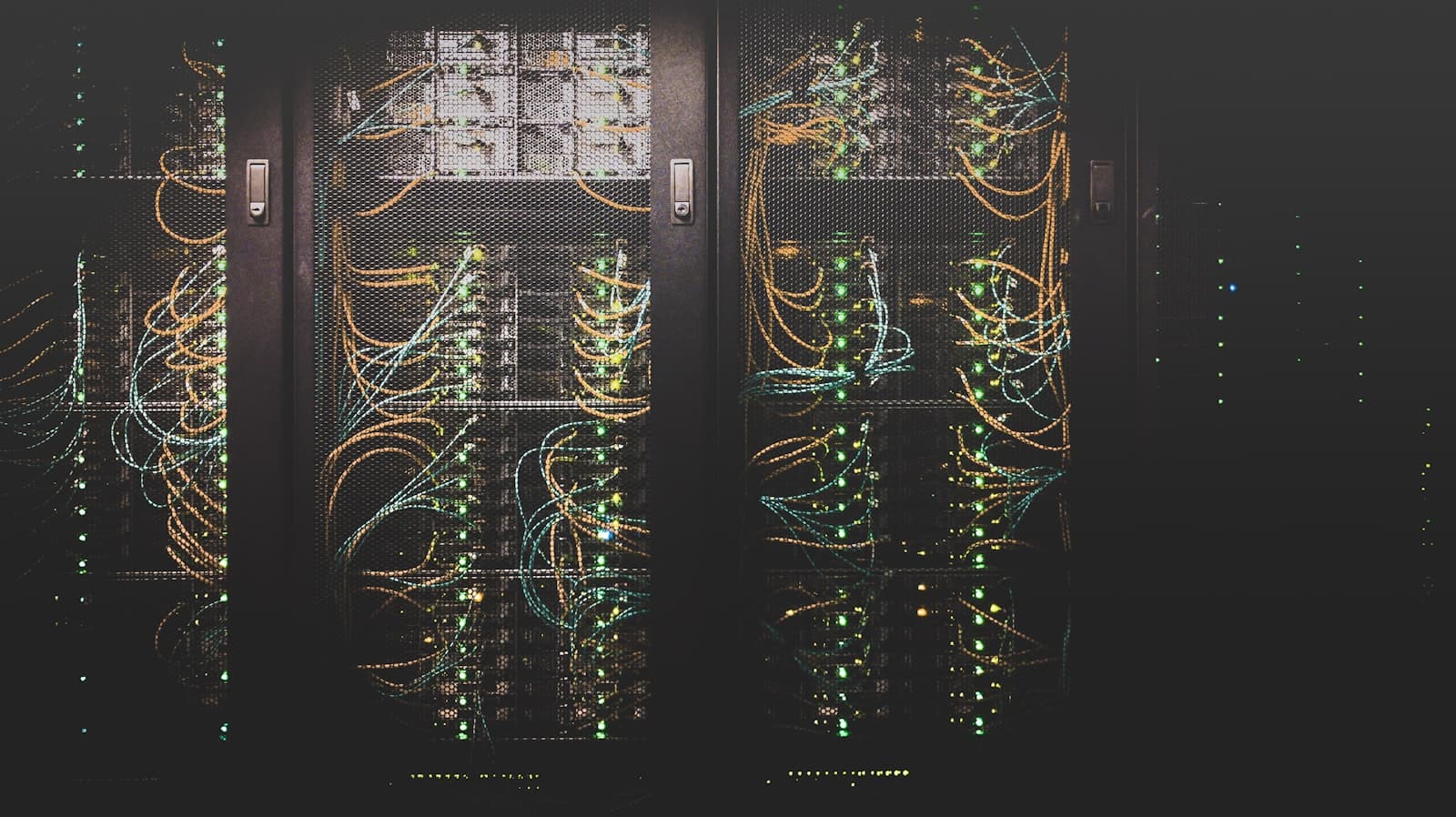 Server room with orange lighting — photo by Unsplash