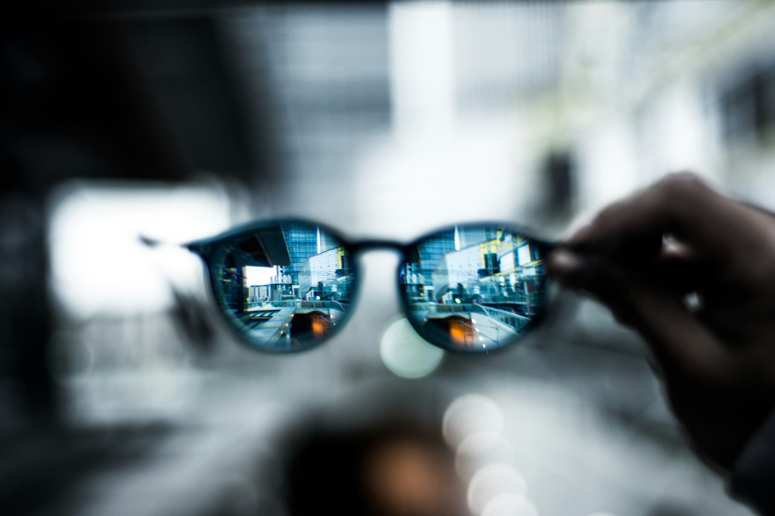 Shallow focus photograph of sunglasses — photo by David Lezcano on Unsplash